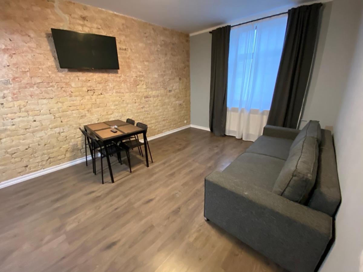 Aparthotel Riga Extérieur photo A living room in a typical apartment